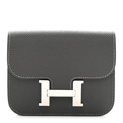 Constance slim wallet front in dark textured leather with H clasp and contrast stitching