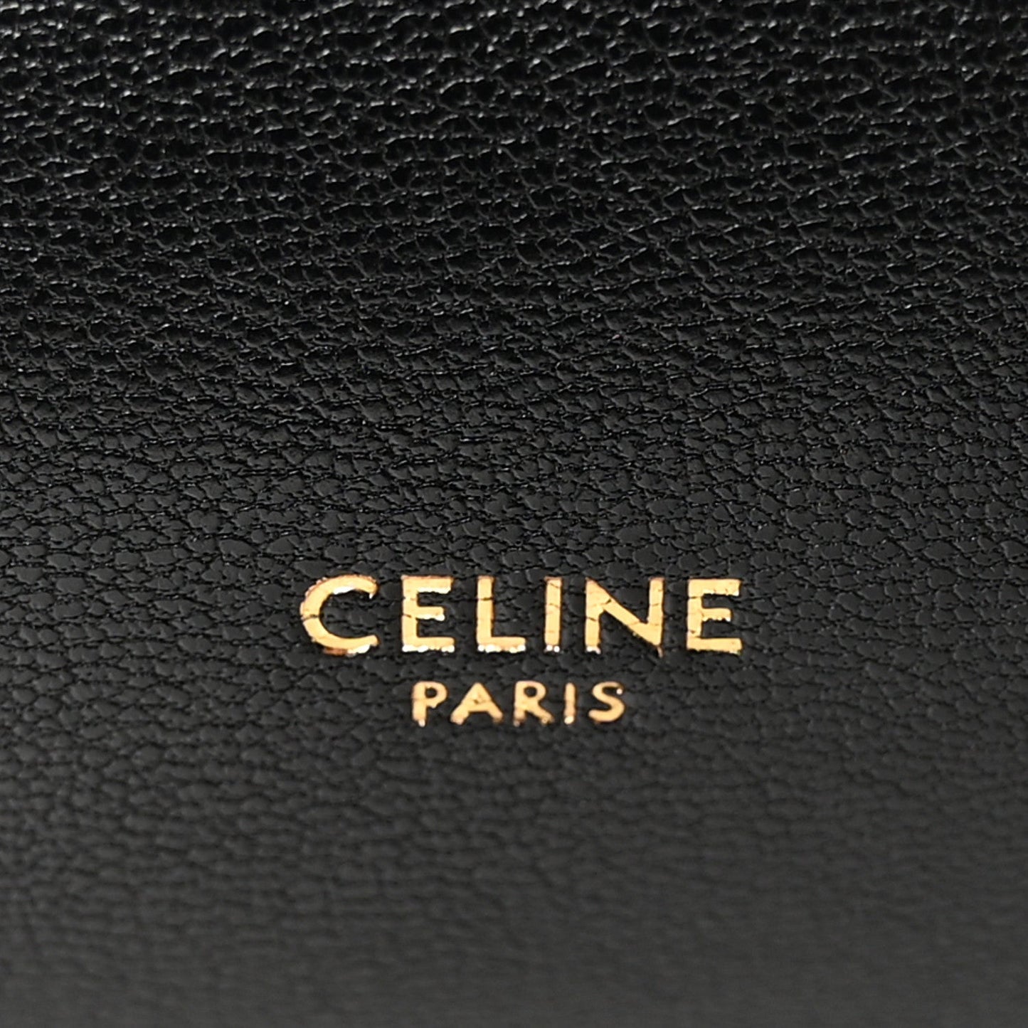 Black leather bag with CELINE PARIS logo embossed.