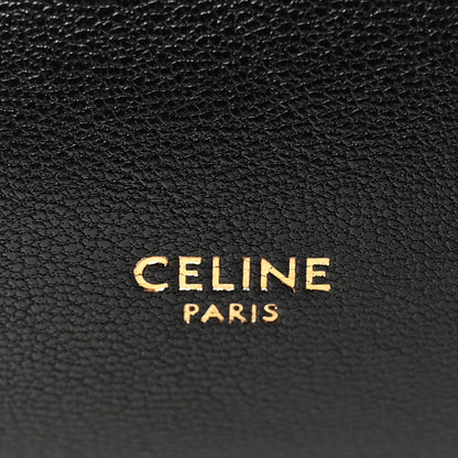 Black leather bag with CELINE PARIS logo embossed.