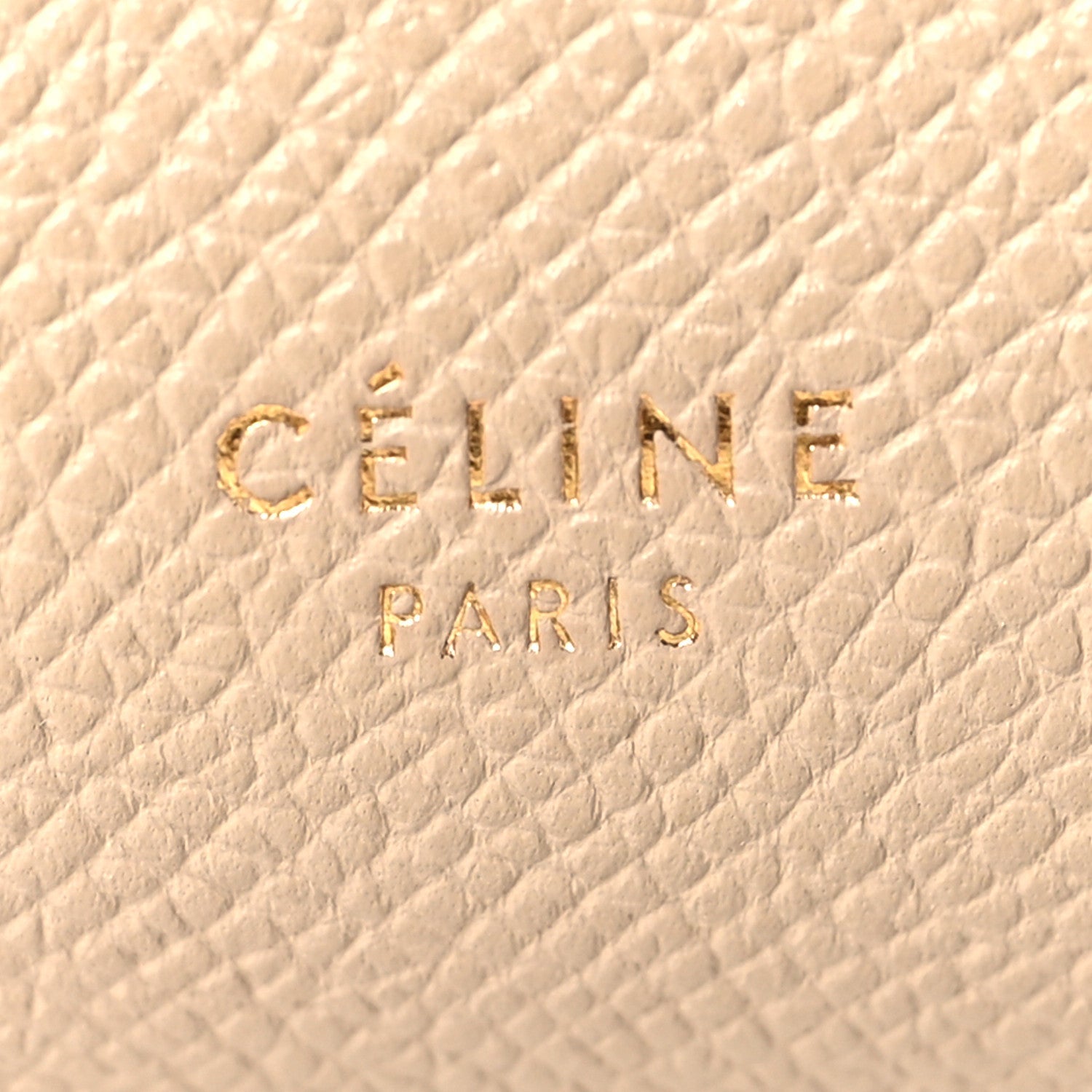 Celine stamp logo on light taupe grained leather, close-up