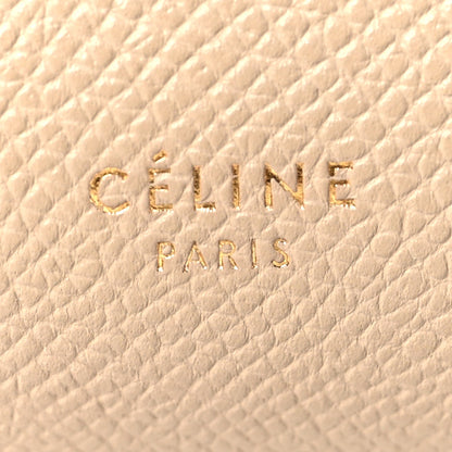 Celine stamp logo on light taupe grained leather, close-up