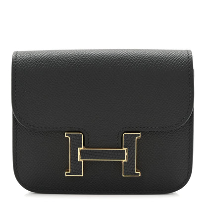 Black slim wallet with gold H clasp, textured epsom leather foldover