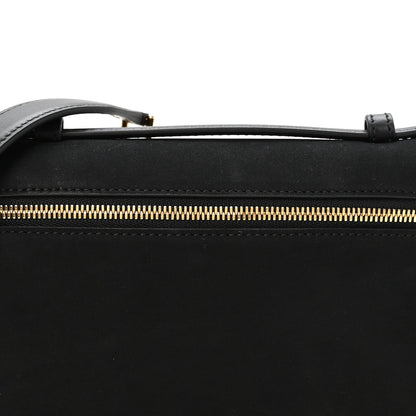 Black pouch with gold-tone zipper and stitched trim