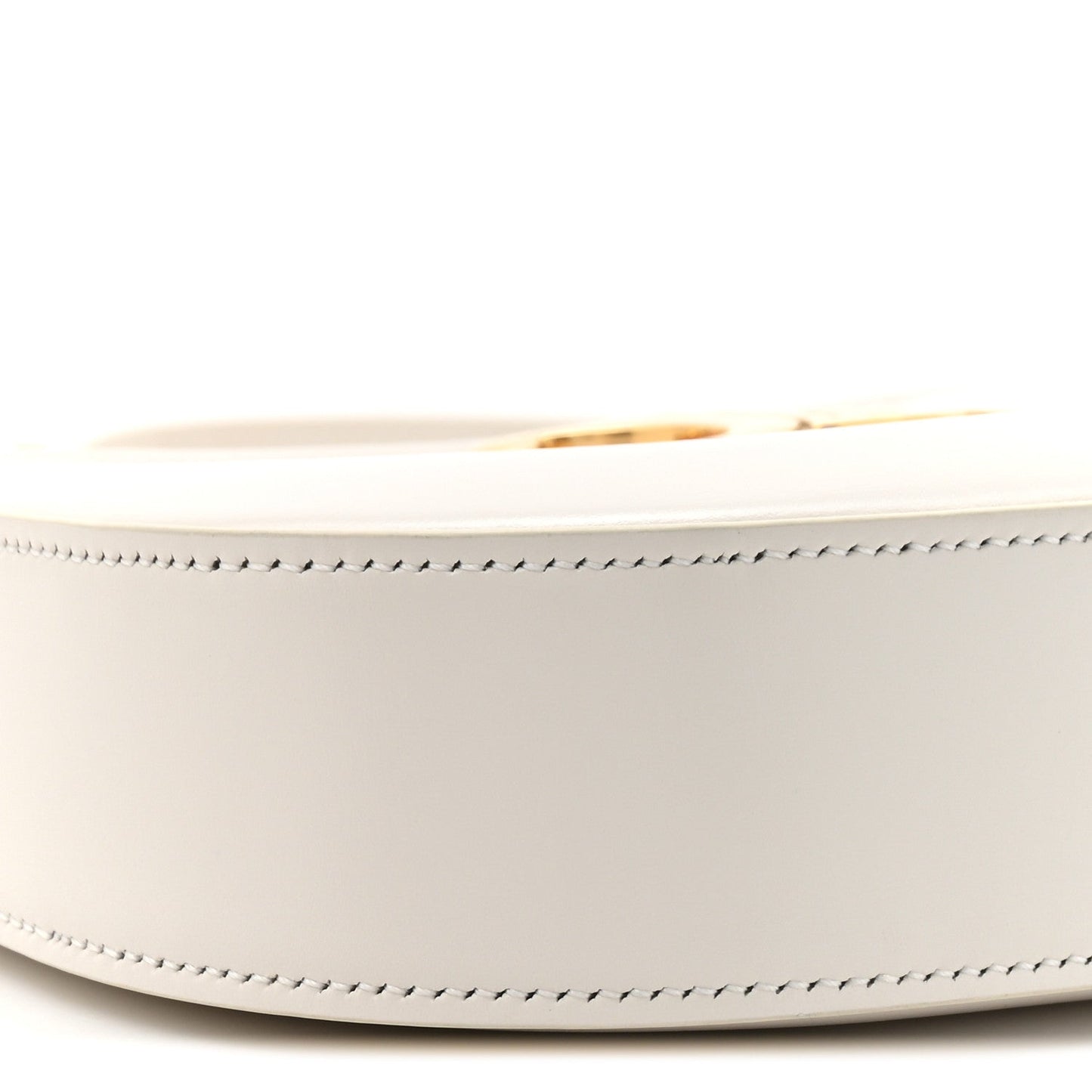Close-up of rice cream bag side with gold-tone zipper pull and stitched trim