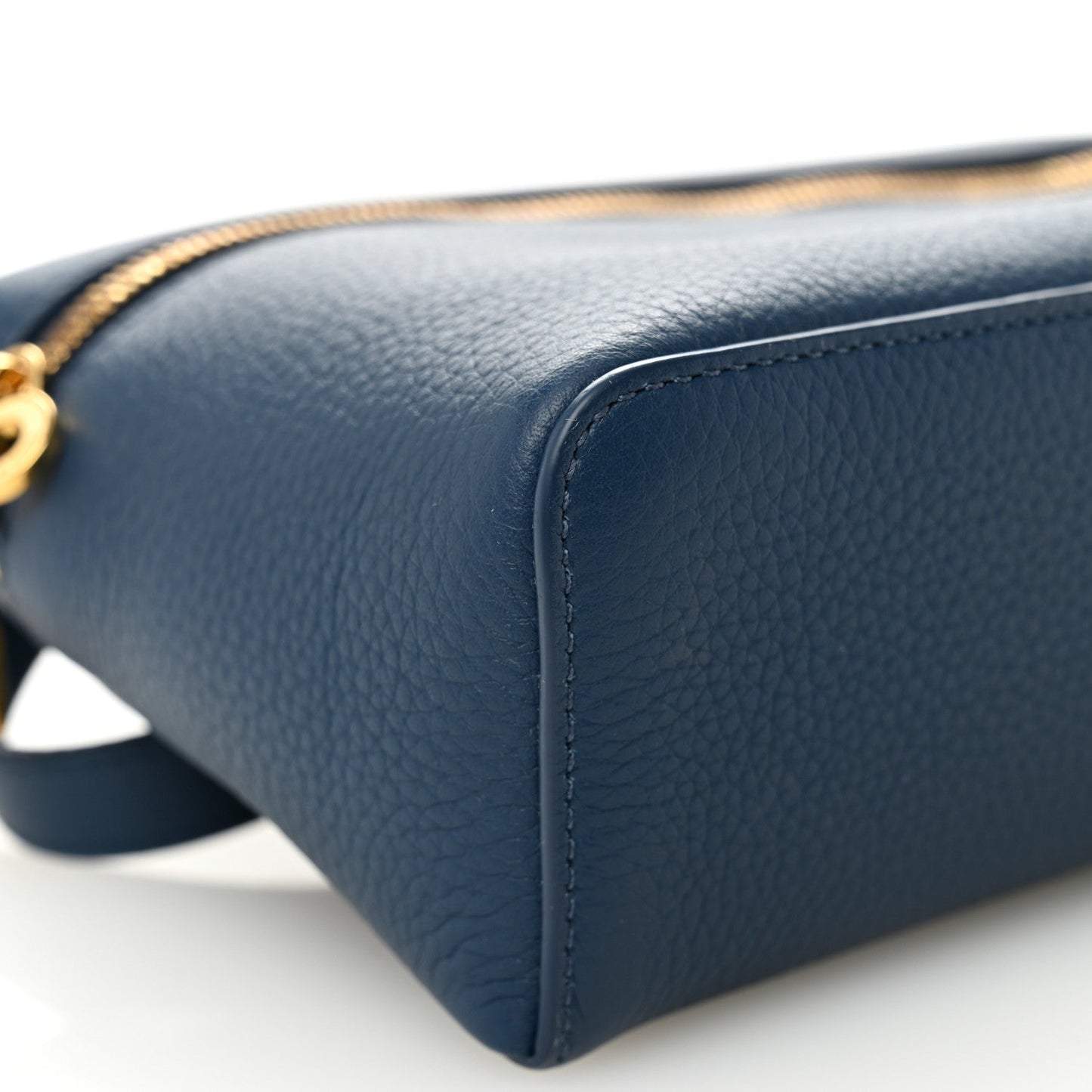 Navy grained calfskin pouch corner with detailed edge stitching