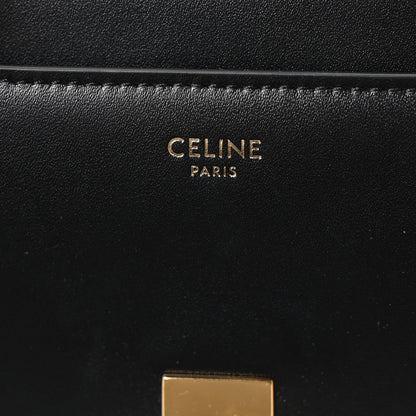Celine leather bag with “CELINE PARIS” embossing in gold on black
