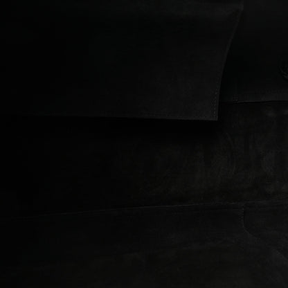 Black leather bag interior lining fabric panel.
