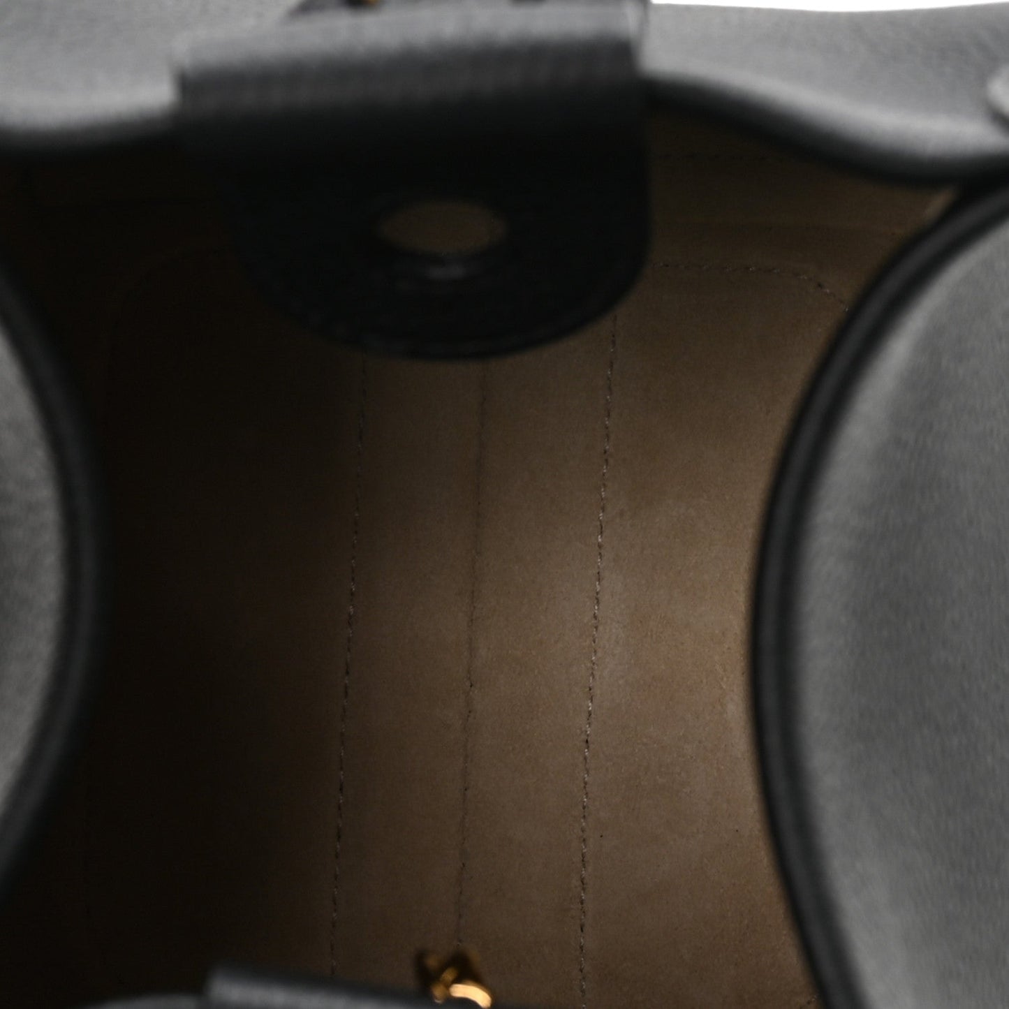 Micro bale bag interior lining in tan leather with visible stitching