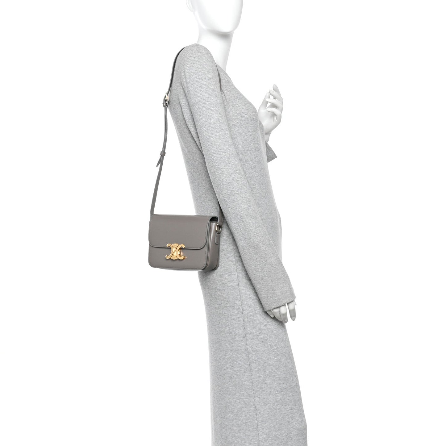 Celine shiny calfskin shoulder bag on model, light gray with gold-tone logo