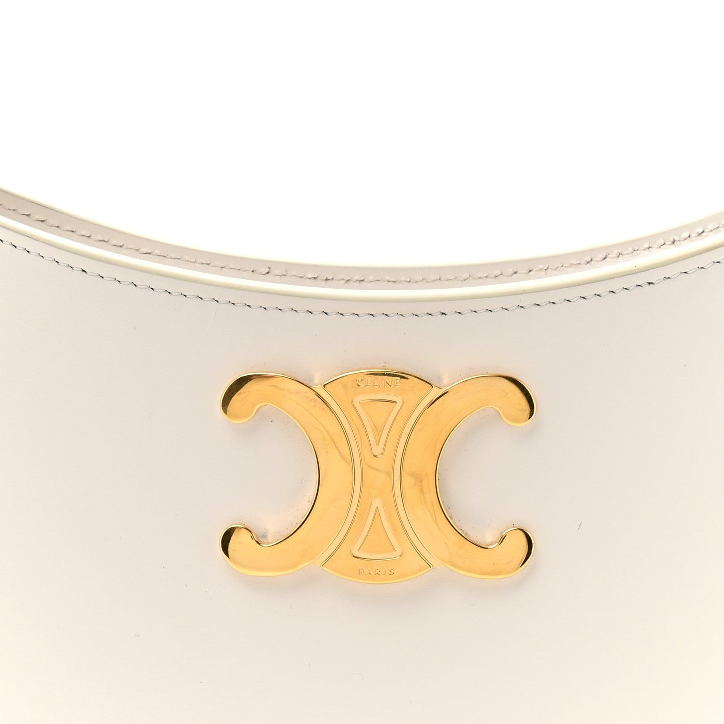 Gold-tone Triomphe logo detail on rice cream shiny leather bag front