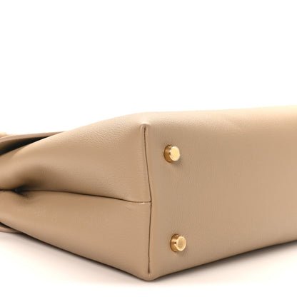 Beige Nino safari bag front seam with gold button hardware