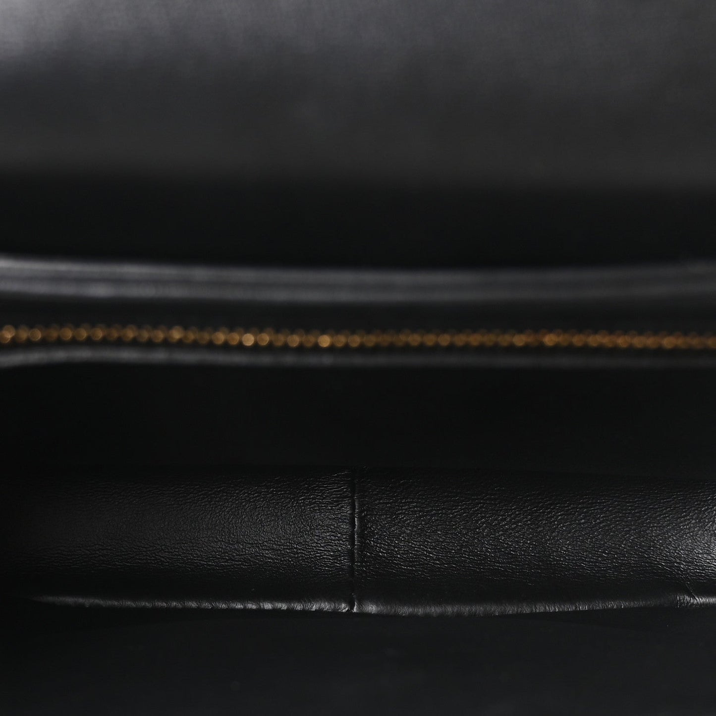 Black leather interior lining with visible stitched seam