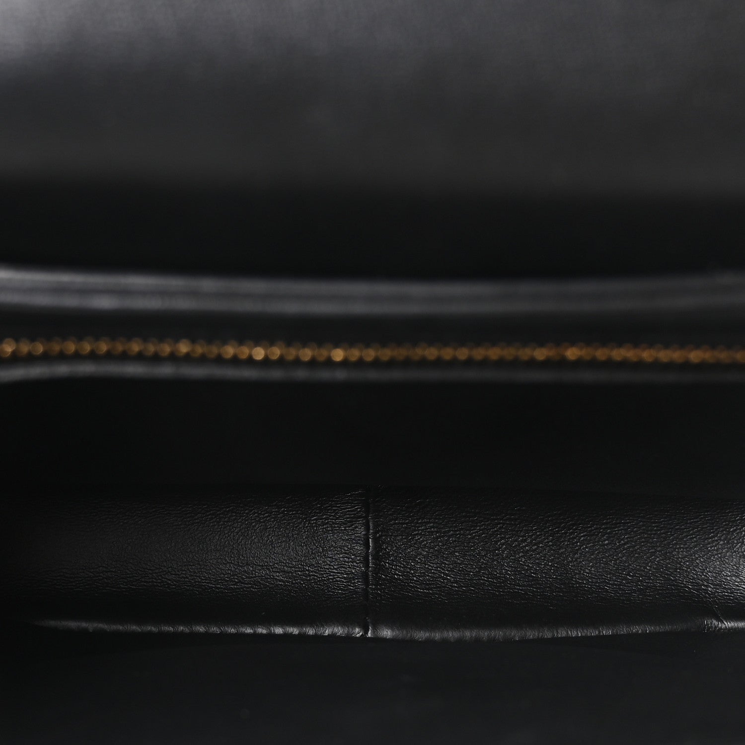Black leather interior lining with visible stitched seam