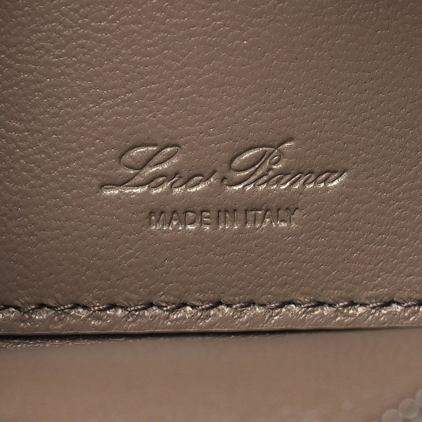 Embossed Loro Piana logo on grained leather with “MADE IN ITALY”