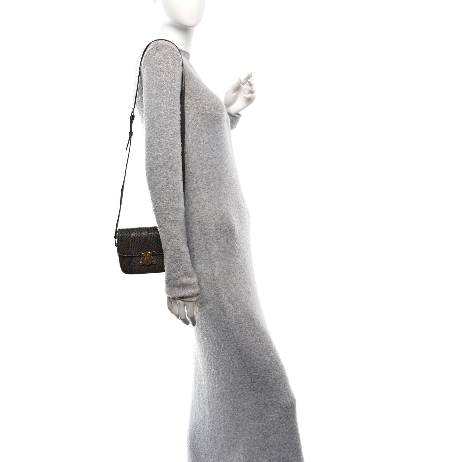 Grey snakeskin shoulder bag worn on shoulder with adjustable strap