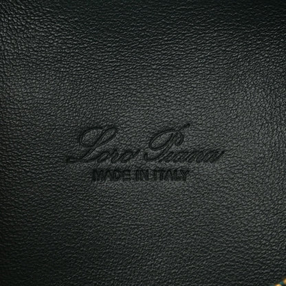 Loro Piana logo stamp on dark green grained calfskin leather pouch.