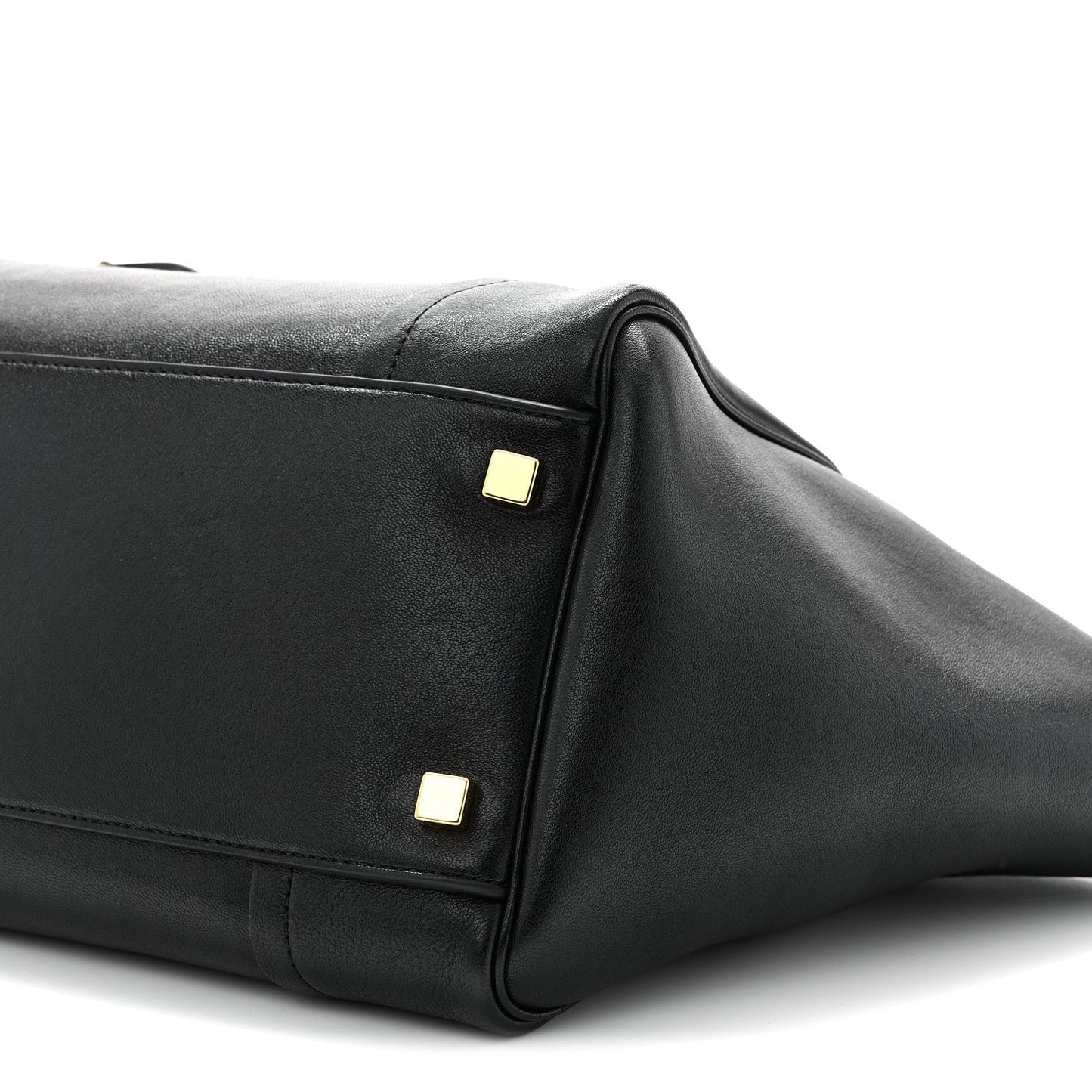 Celine black leather tote side panel close-up with gold hardware studs