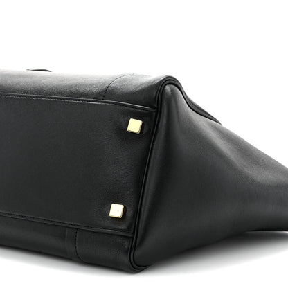 Celine black leather tote side panel close-up with gold hardware studs