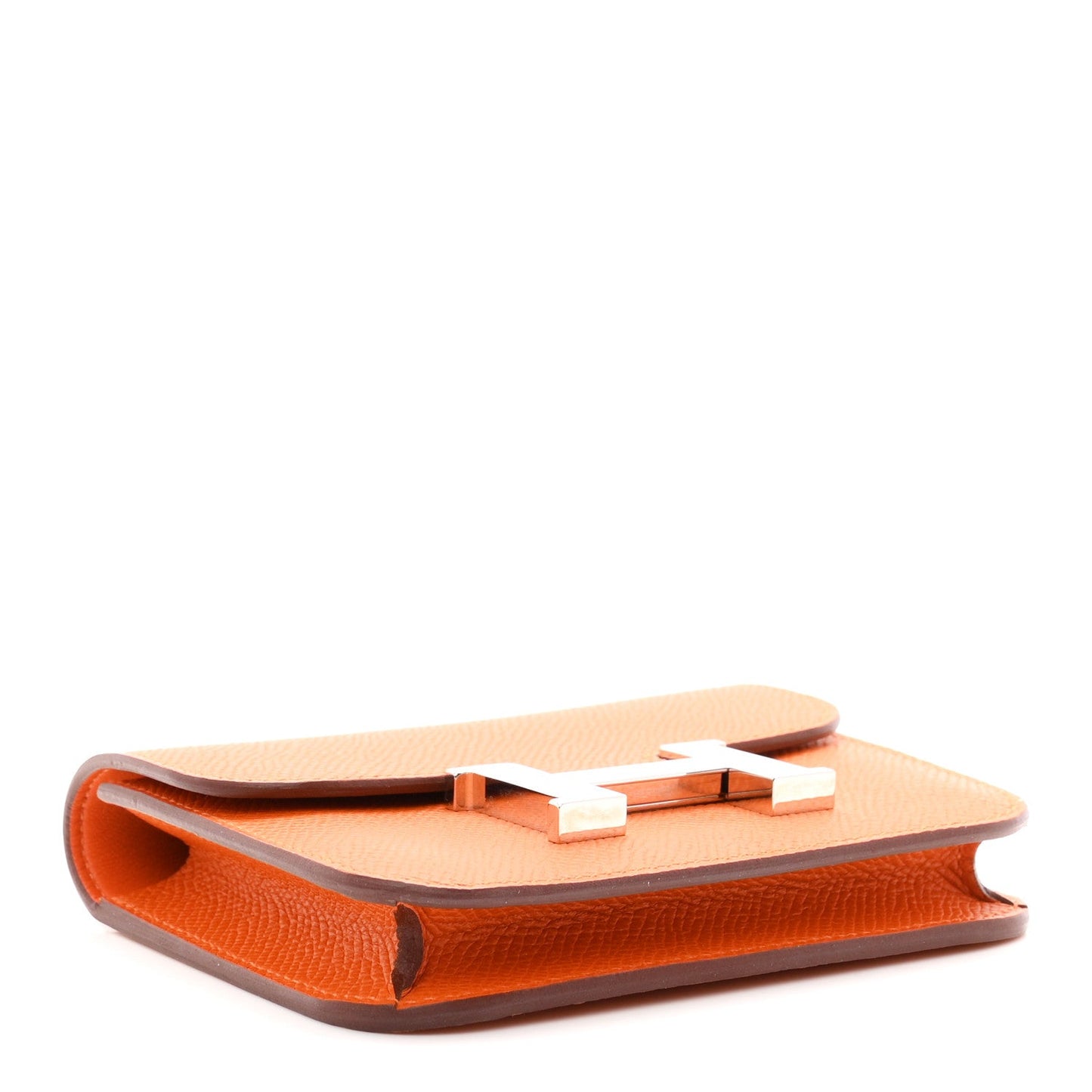 Orange Epsom leather slim wallet underside with H clasp detail.