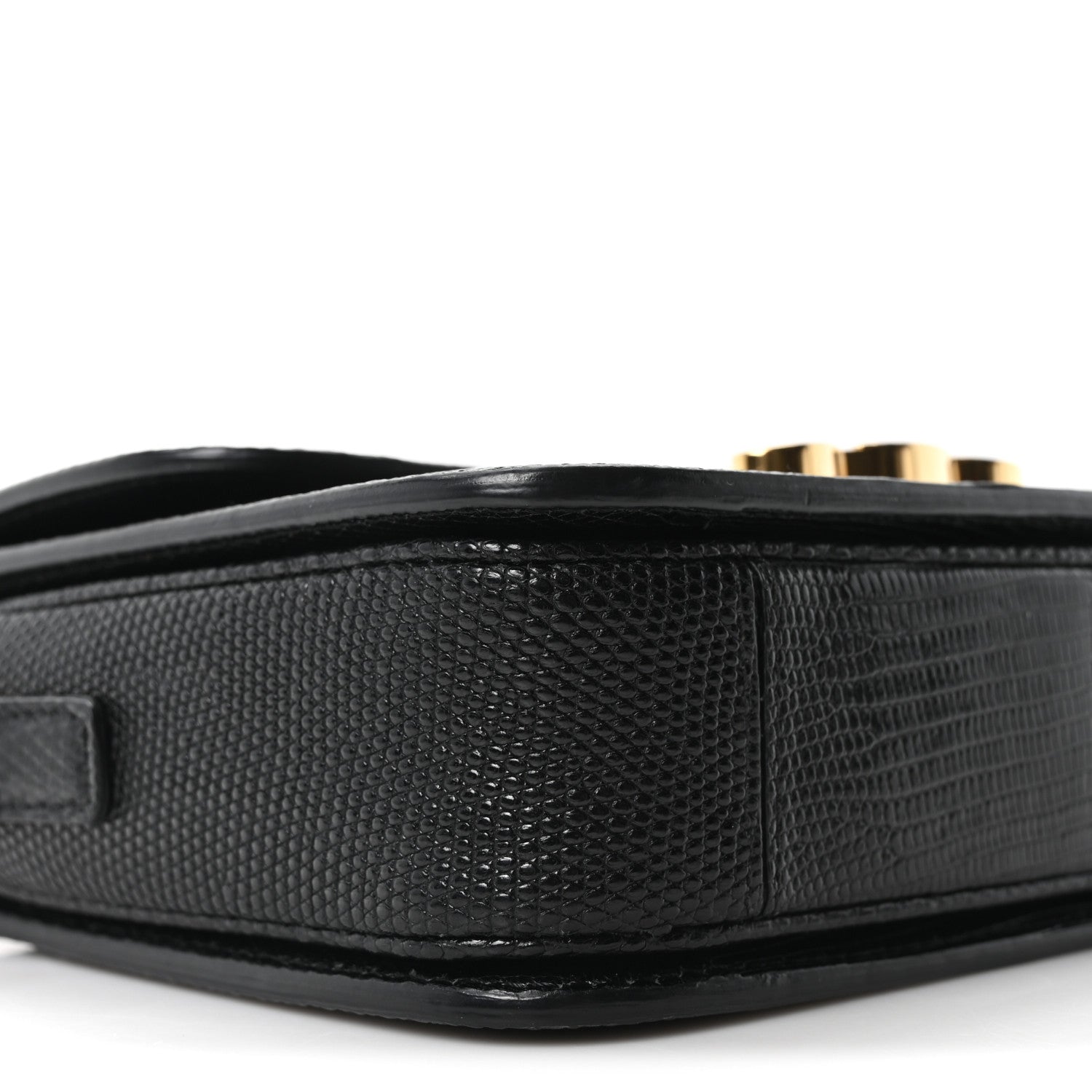 Black lizard-embossed side panel of flap shoulder bag