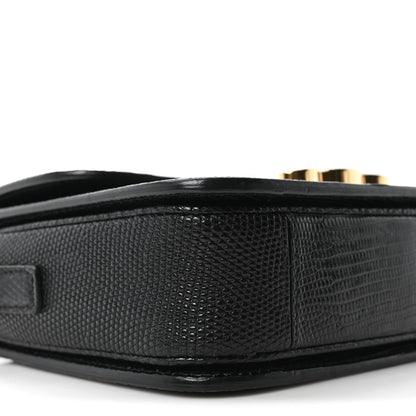 Black lizard-embossed side panel of flap shoulder bag