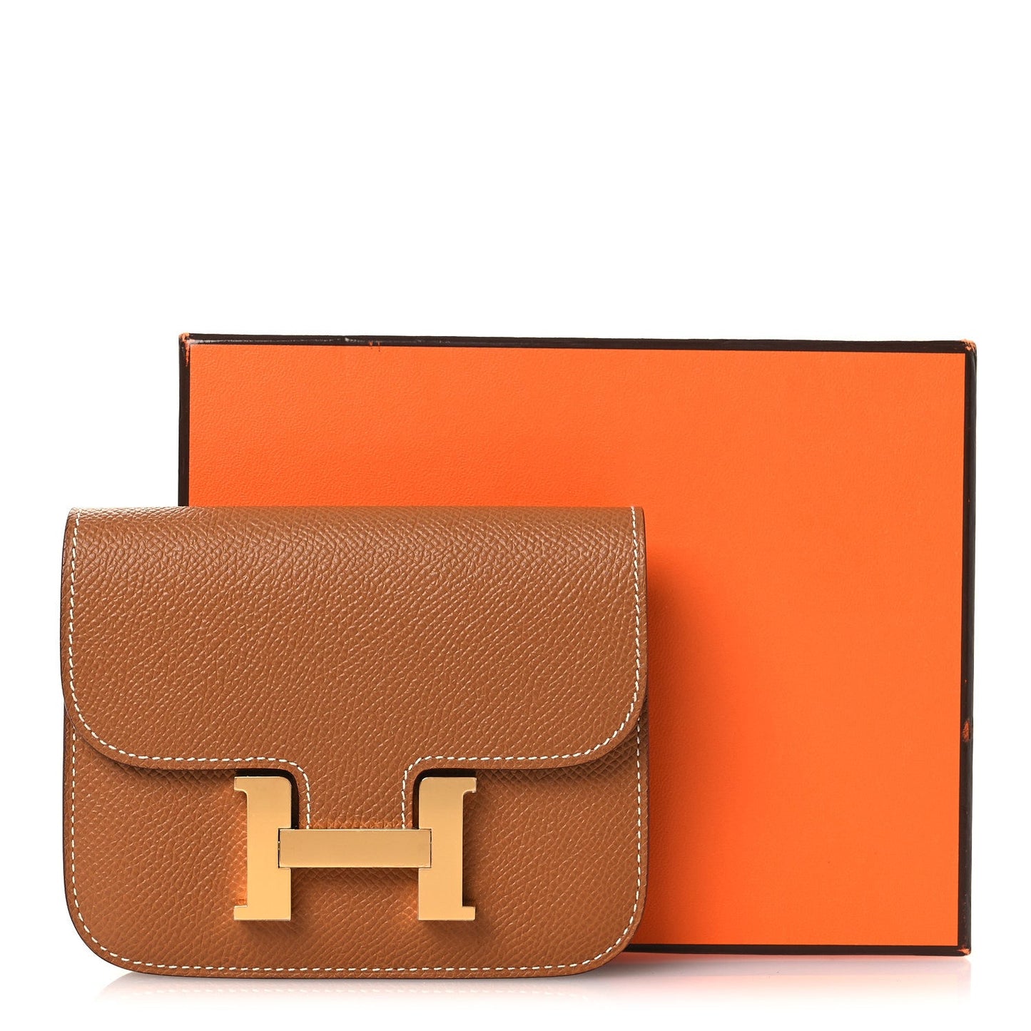 Constance slim wallet in textured tan leather with gold-tone H clasp and front flap