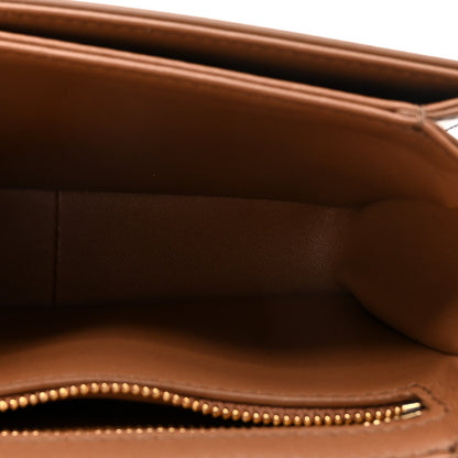 Shiny calfskin bag interior with zipper trim and stitched edge