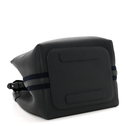 Dark navy leather bag with front flap panel and adjustable shoulder strap