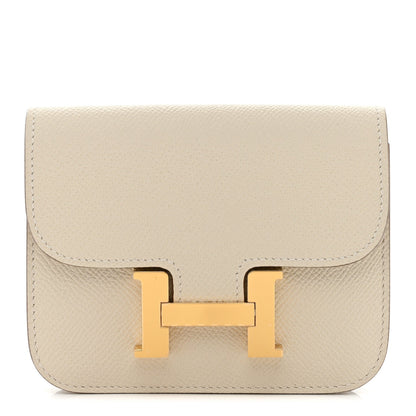 Slim wallet with flap and gold H clasp, light cream textured leather