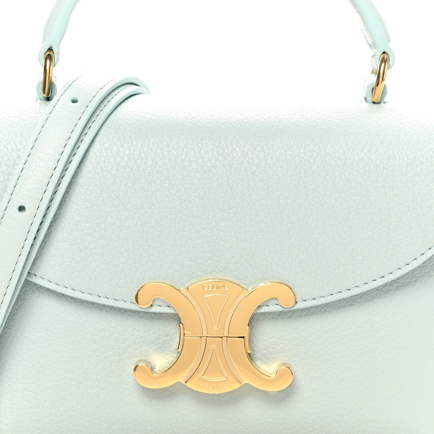 Light blue leather mini bag front with gold logo clasp and top handles