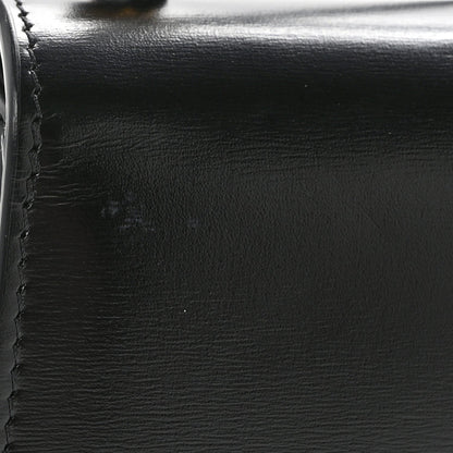 Black shiny calfskin with visible stitching and smooth edge close-up