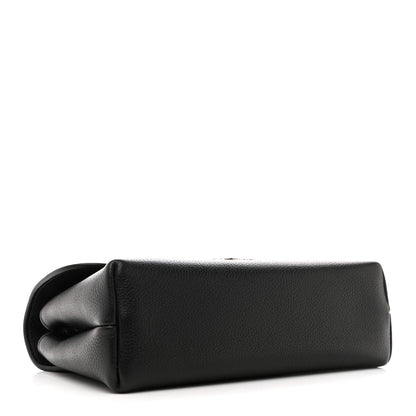 Black leather shoulder bag with rounded base and gathered flap detail