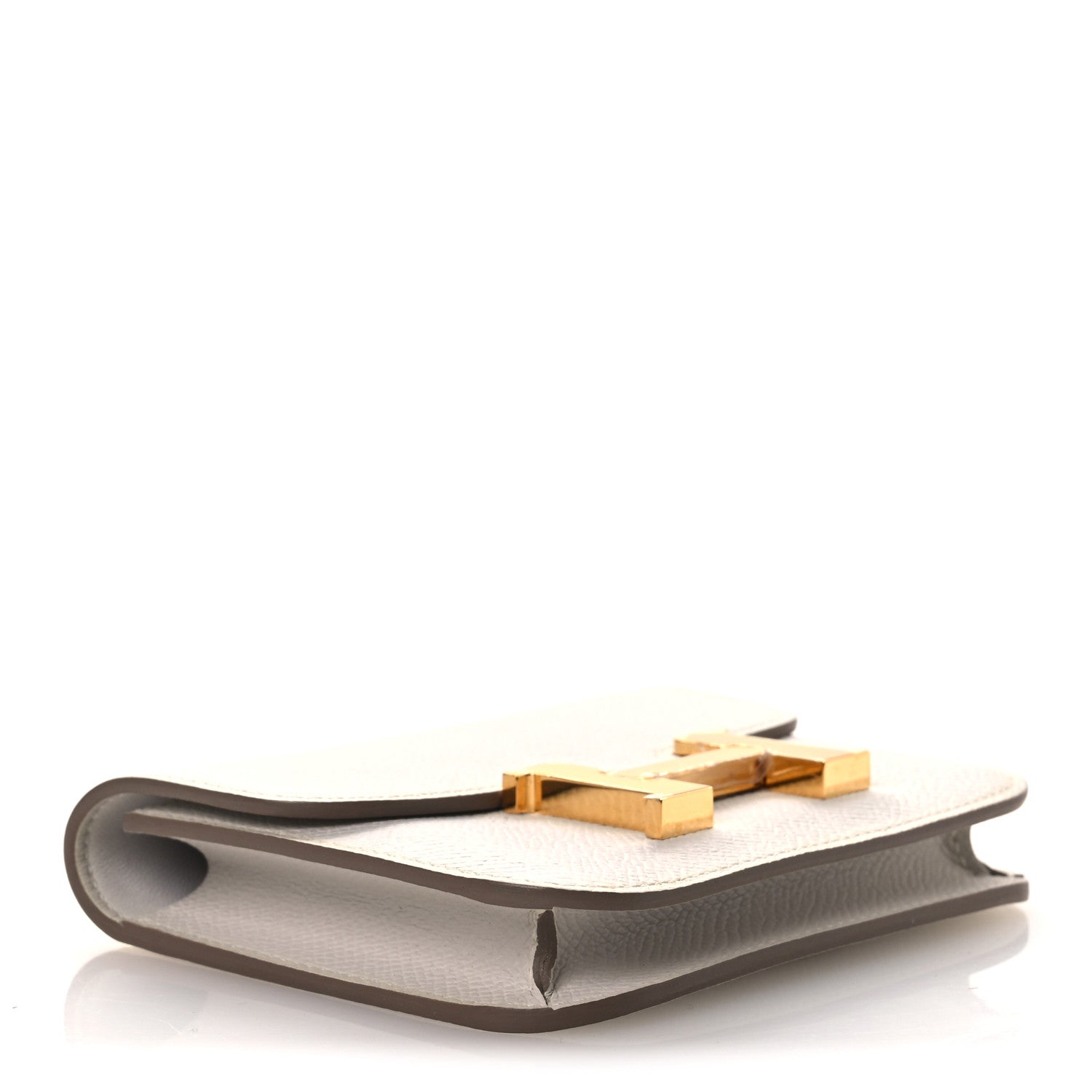 Pale gray leather slim wallet with gold-tone clasp detail on top edge