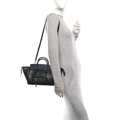 Celine black leather mini tote worn crossbody with adjustable strap