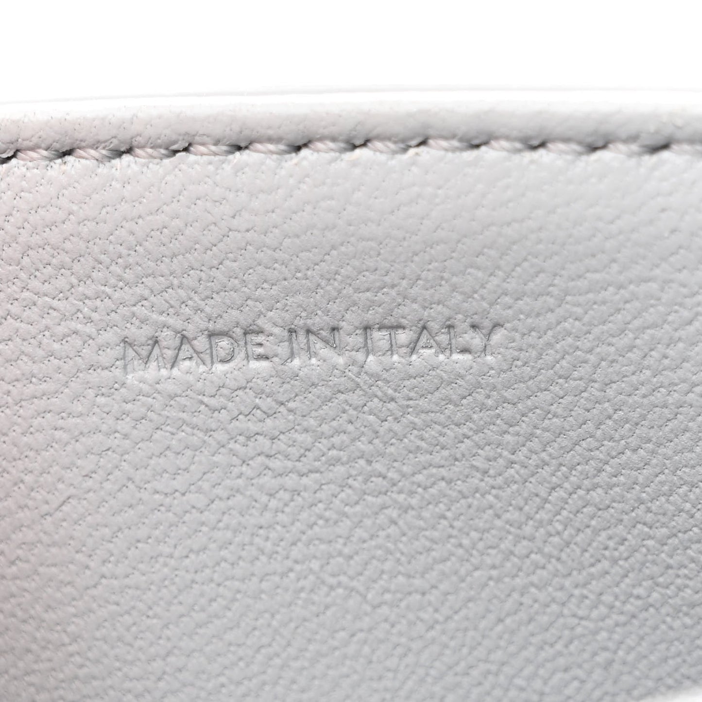 Shiny calfskin bag interior label reading MADE IN ITALY