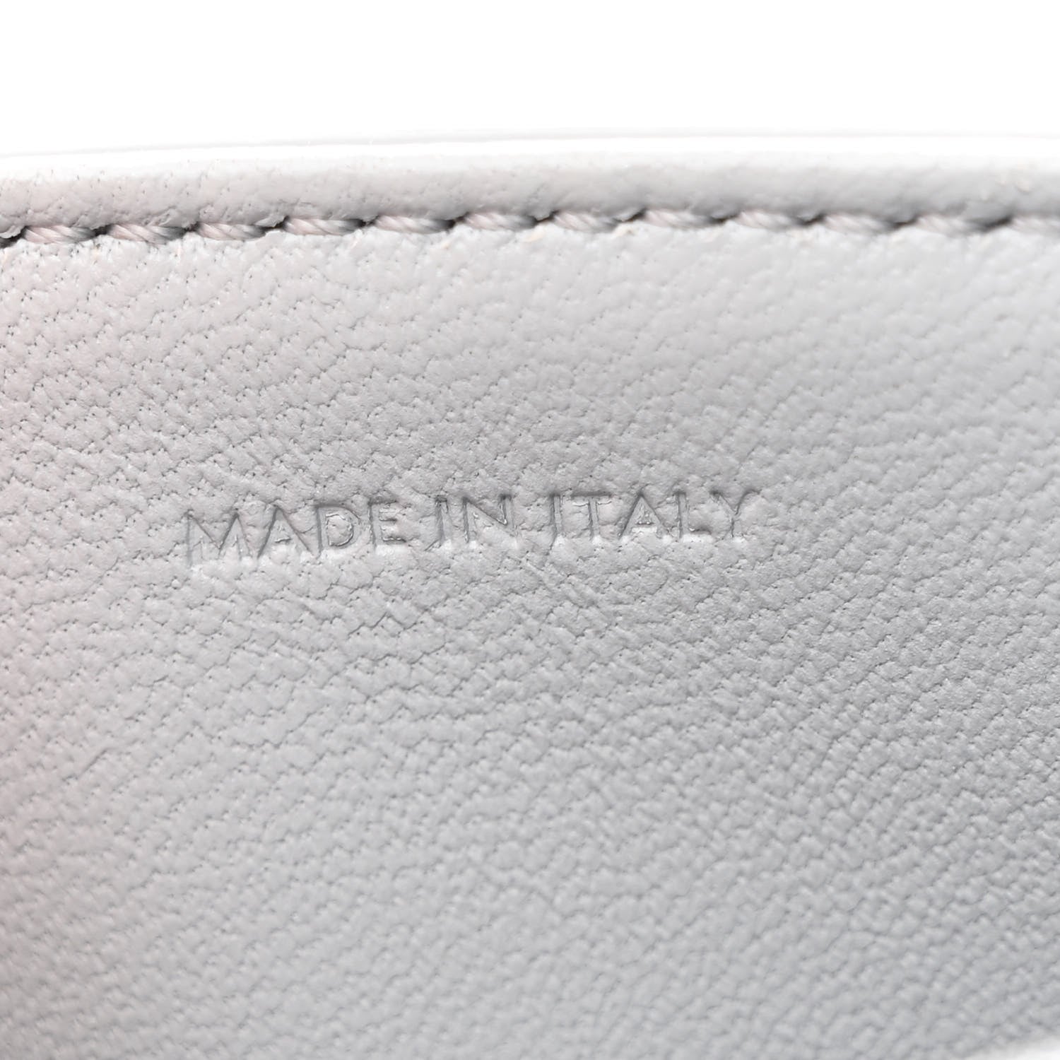 Shiny calfskin bag interior label reading MADE IN ITALY