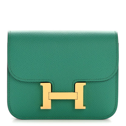 Hermes Constance Slim wallet in textured green leather with gold H clasp
