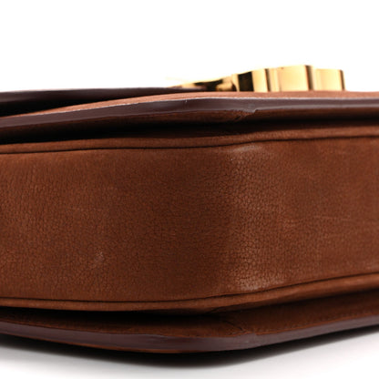 Chestnut shoulder bag side profile with gold-toned hardware on top