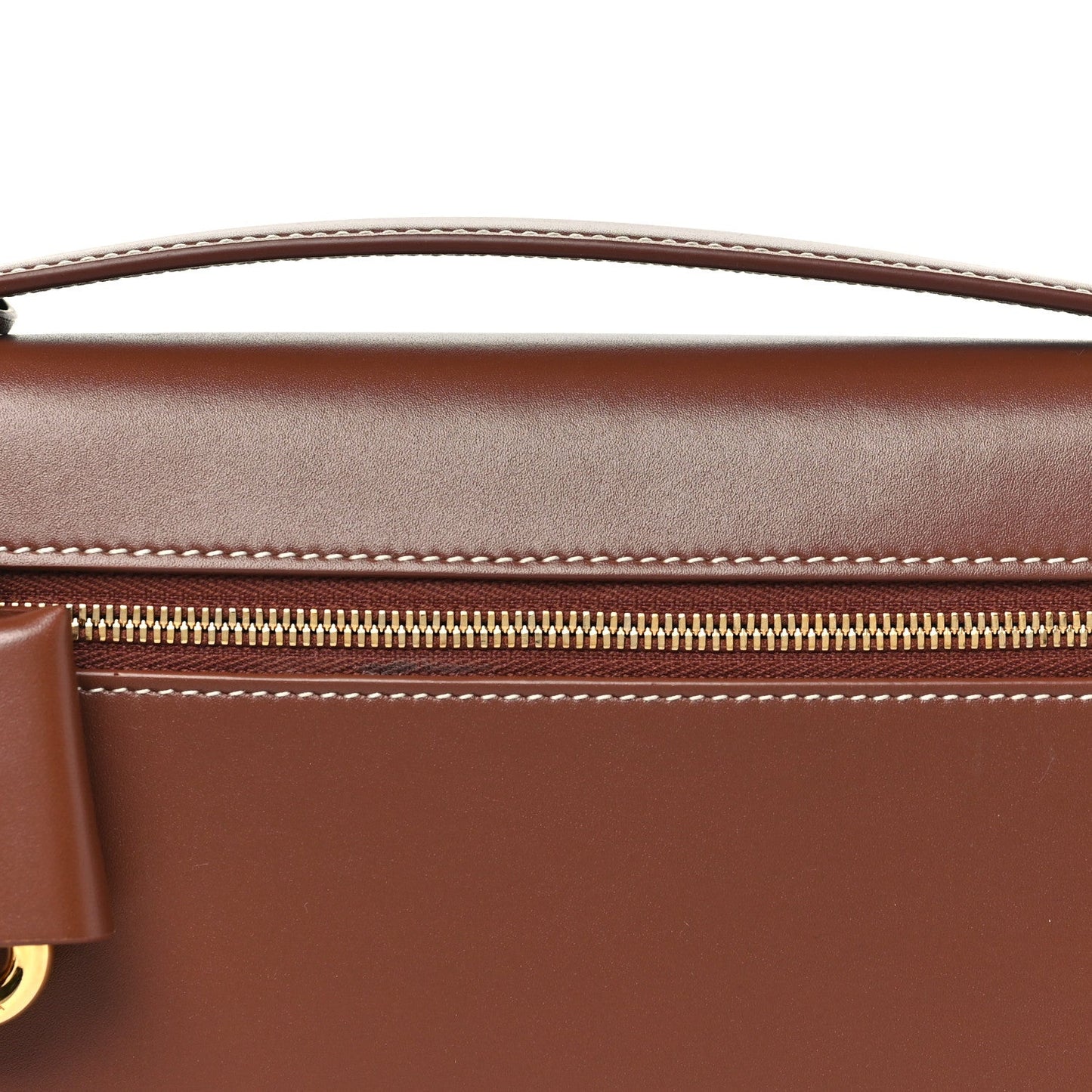 Loro Piana smooth calfskin clutch detail with gold zipper and contrast stitching