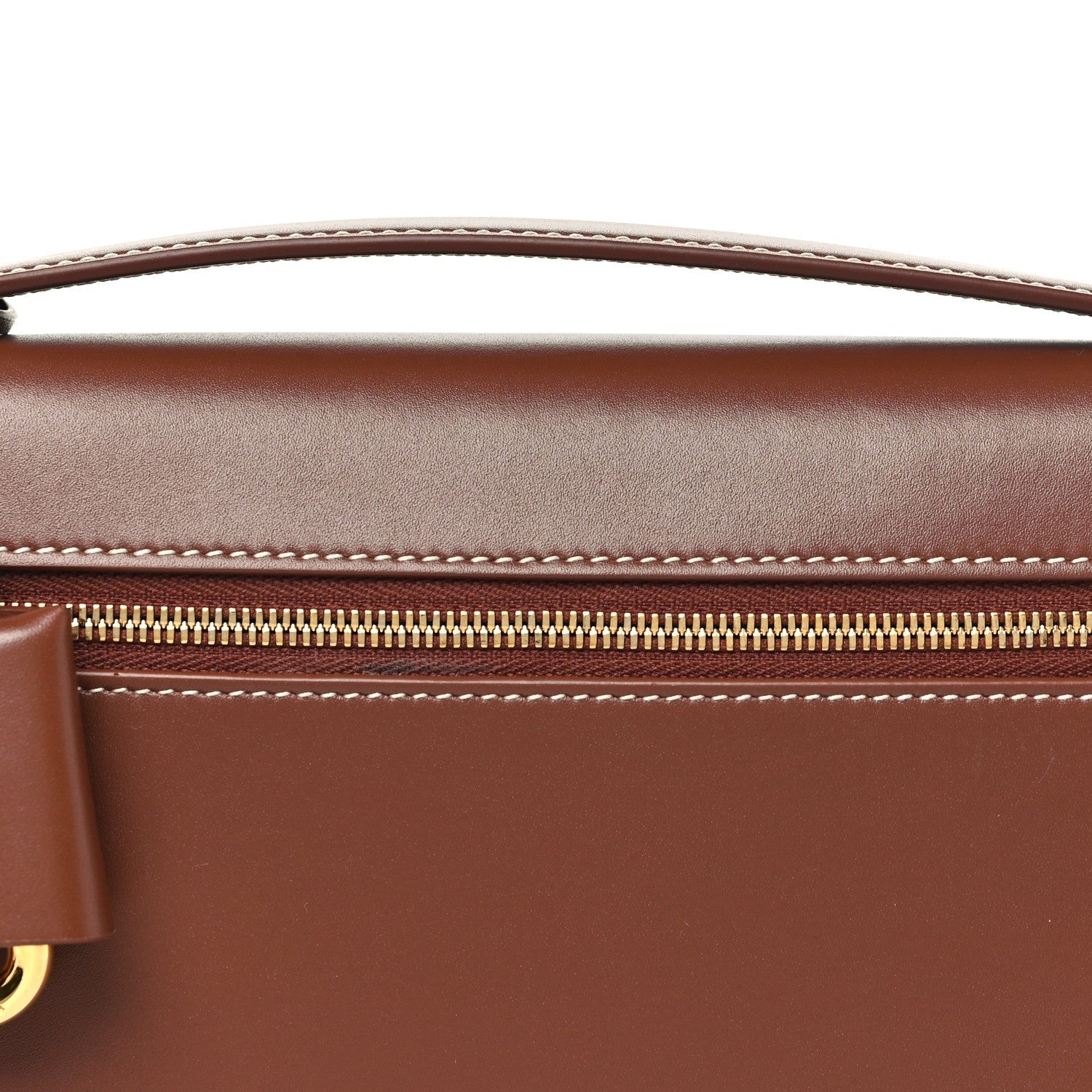 Loro Piana smooth calfskin clutch detail with gold zipper and contrast stitching