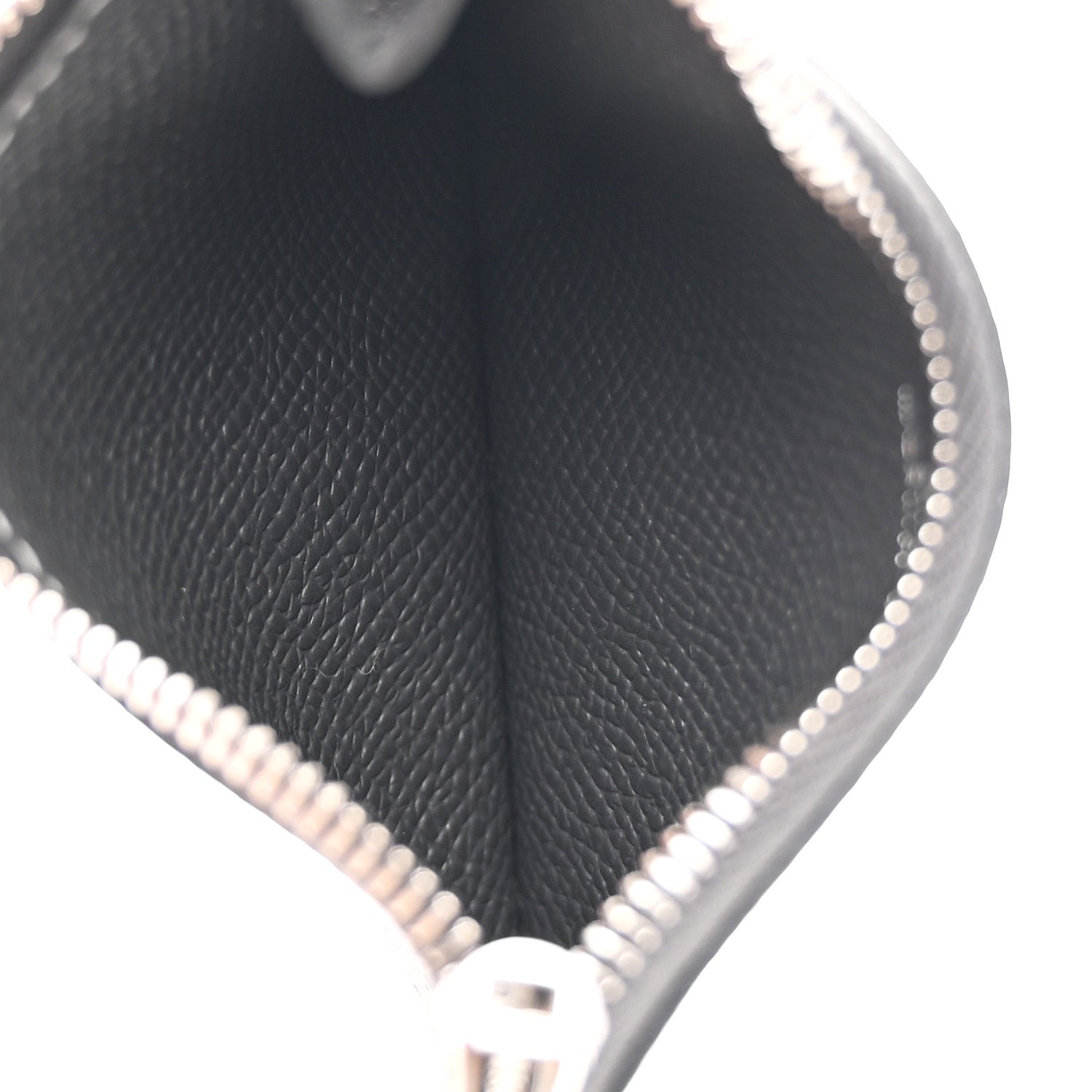 Constance slim wallet in dark textured leather, close-up of edge stitching