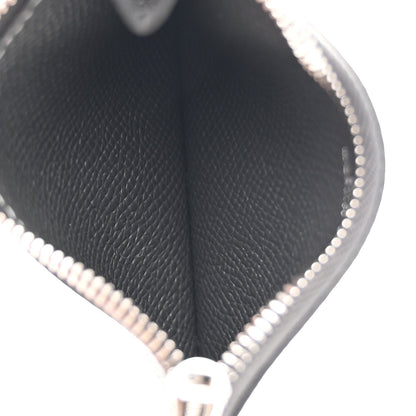 Constance slim wallet in dark textured leather, close-up of edge stitching