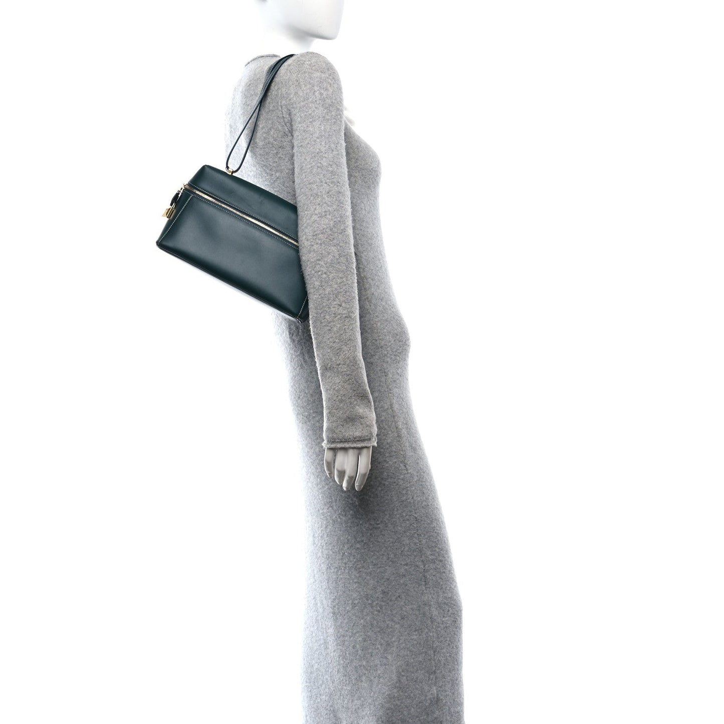 Petrolio teal leather top-handle bag worn on shoulder, gold hardware