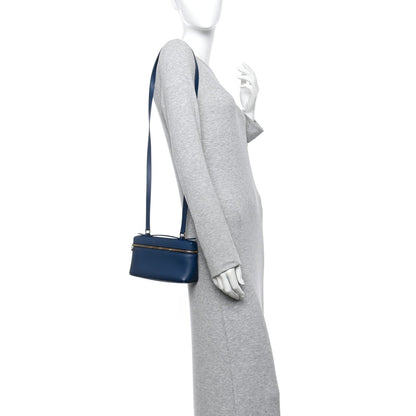 Navy grained calfskin crossbody pouch with long adjustable strap