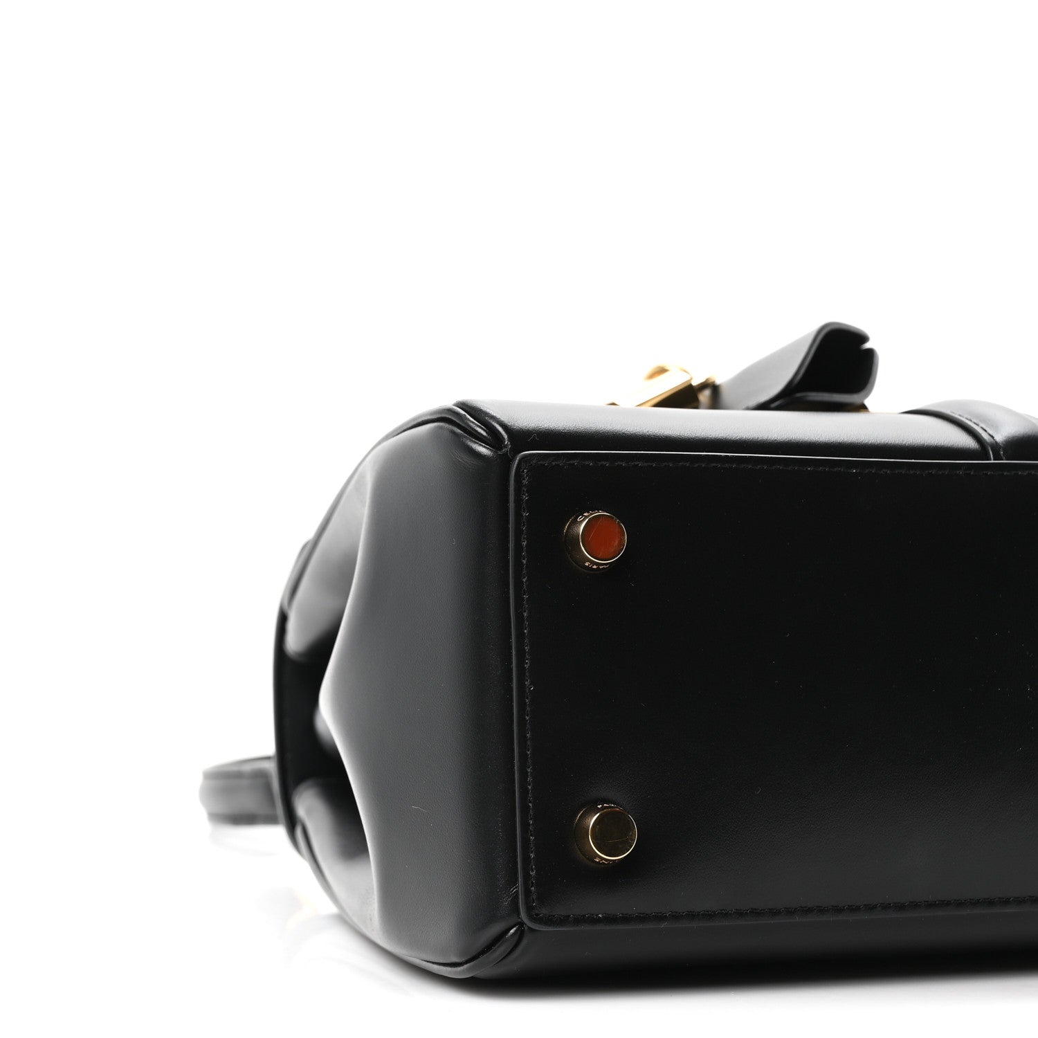 Celine mini bag side detail in black leather with gold snaps and small round emblem