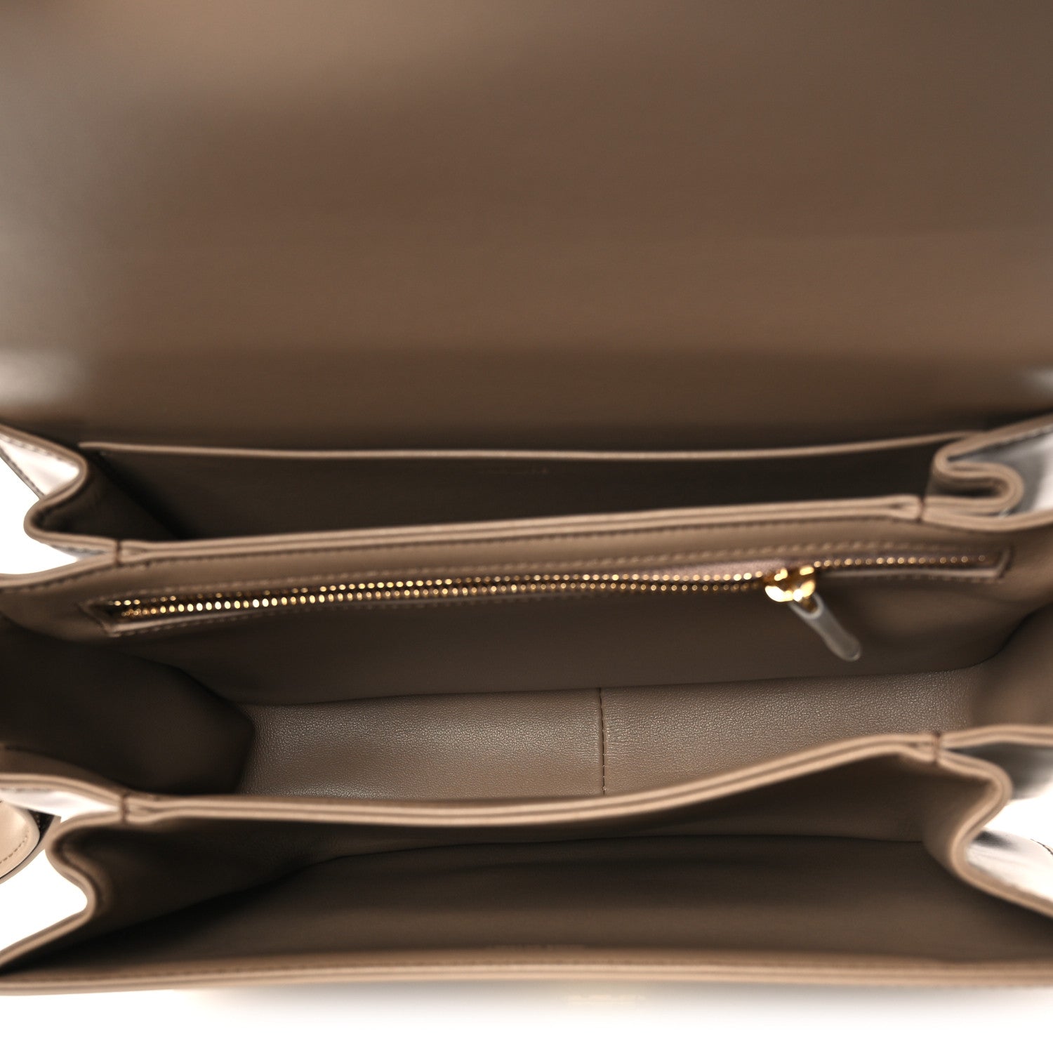 Beige leather bag interior with top zipper and stitched side pocket