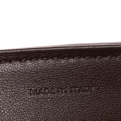 Leather edge seam with 'MADE IN' stamp.