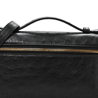 Black ostrich pocket pouch top view with gold-tone zipper and handle attachment