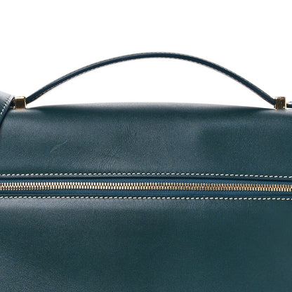 Petrolio teal leather bag top with arched handle and striped zipper trim