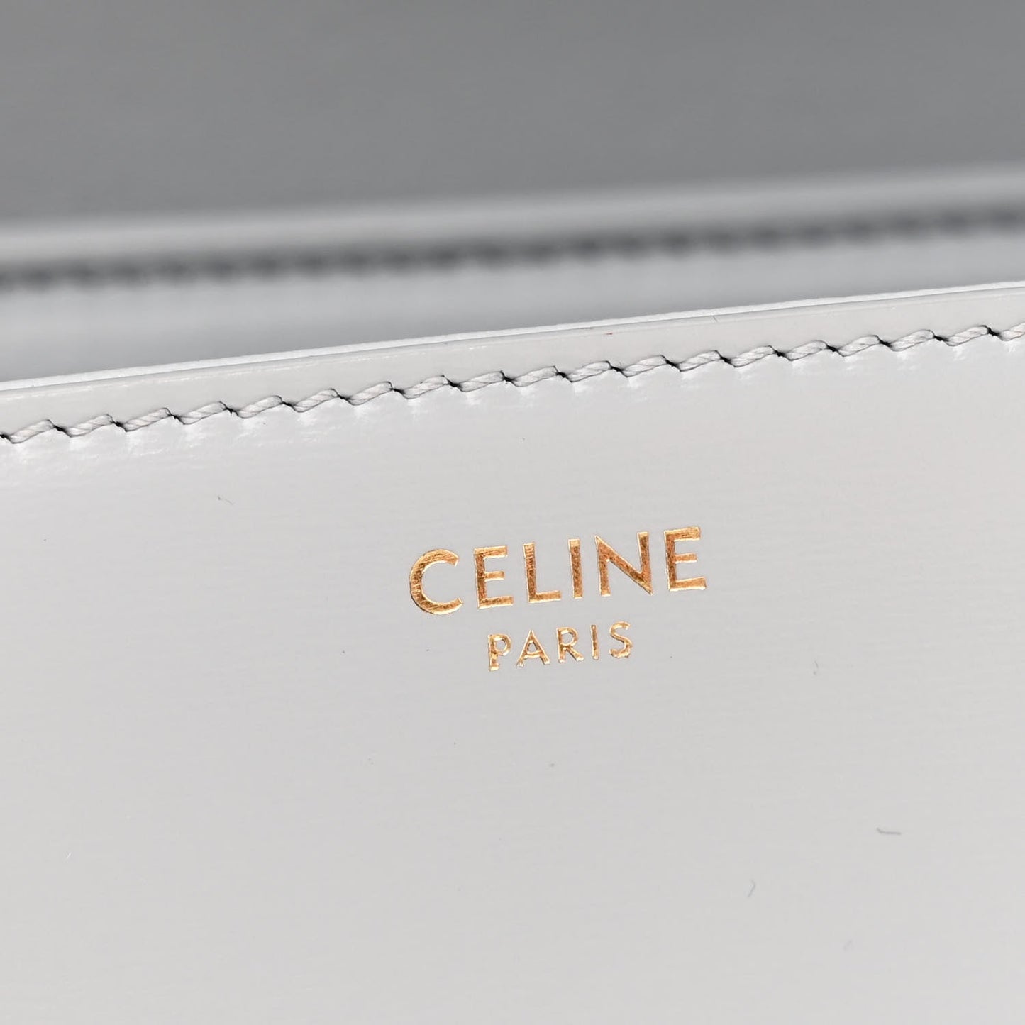 Shiny calfskin flap with CELINE PARIS embossed logo